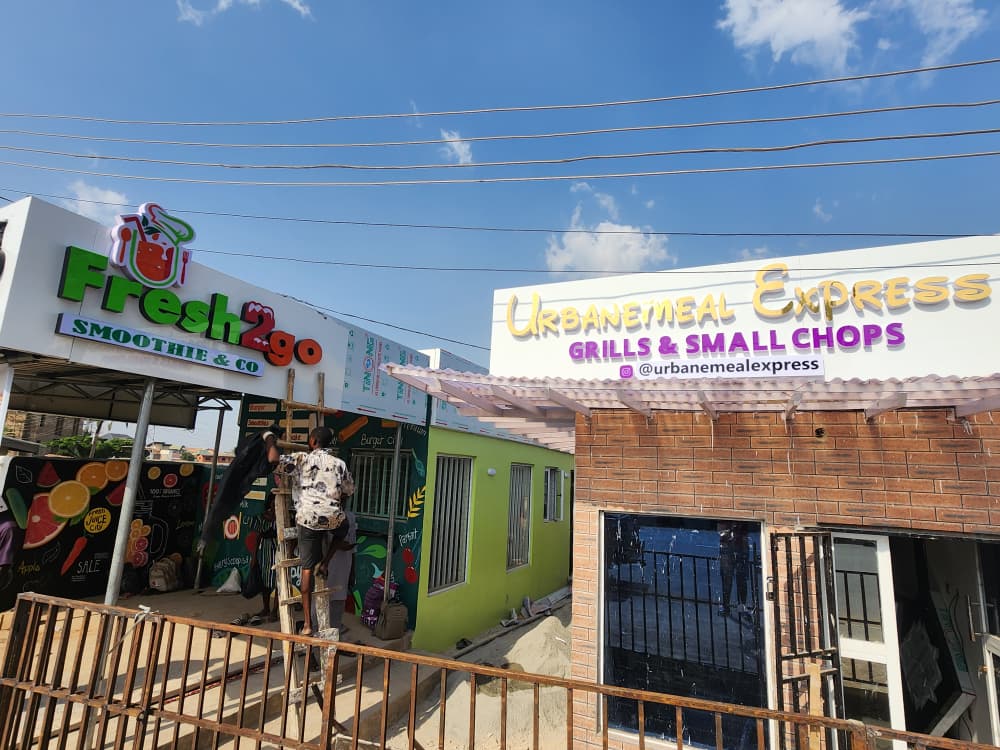 Illuminated storefront signage for Fresh2Go Smoothie & Co and Urbanemeal Express Grills & Small Chops