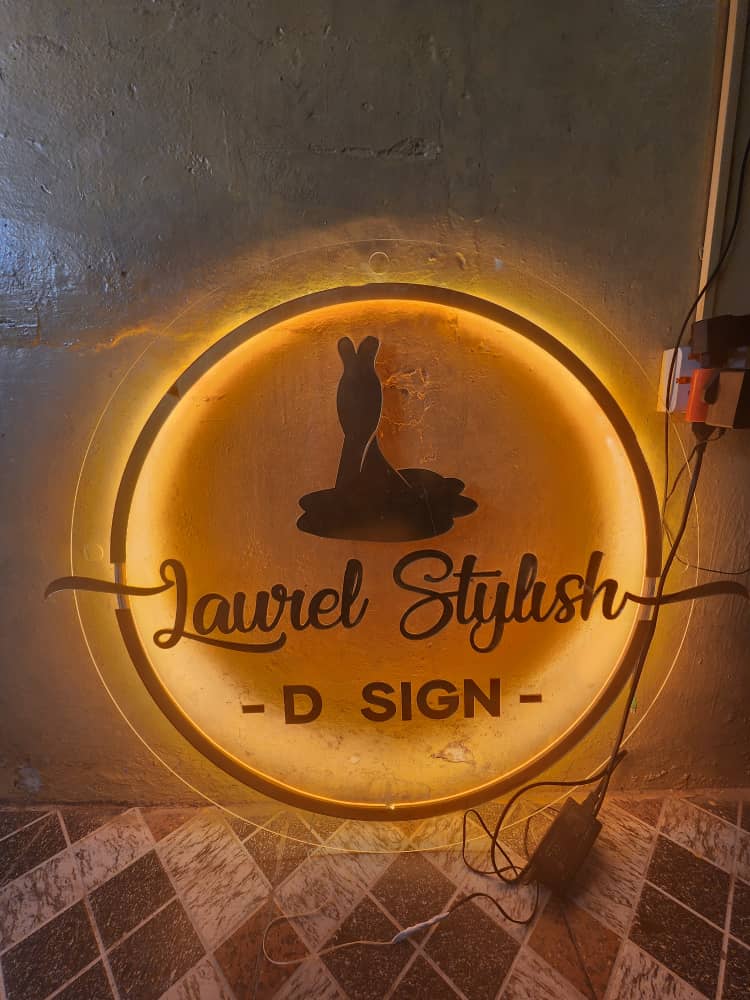 Warm halo-lit Laurel Stylish D Sign neon disc with mannequin silhouette
