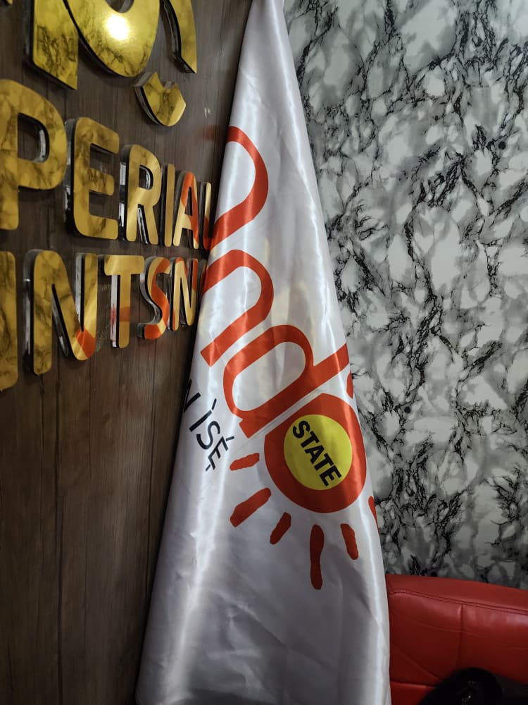 Printed Ondo State ceremonial flag with sun emblem, displayed at Imperial Prints studio