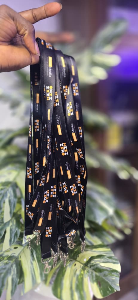 Custom sublimation-printed MoMo Media branded lanyards with metal clips