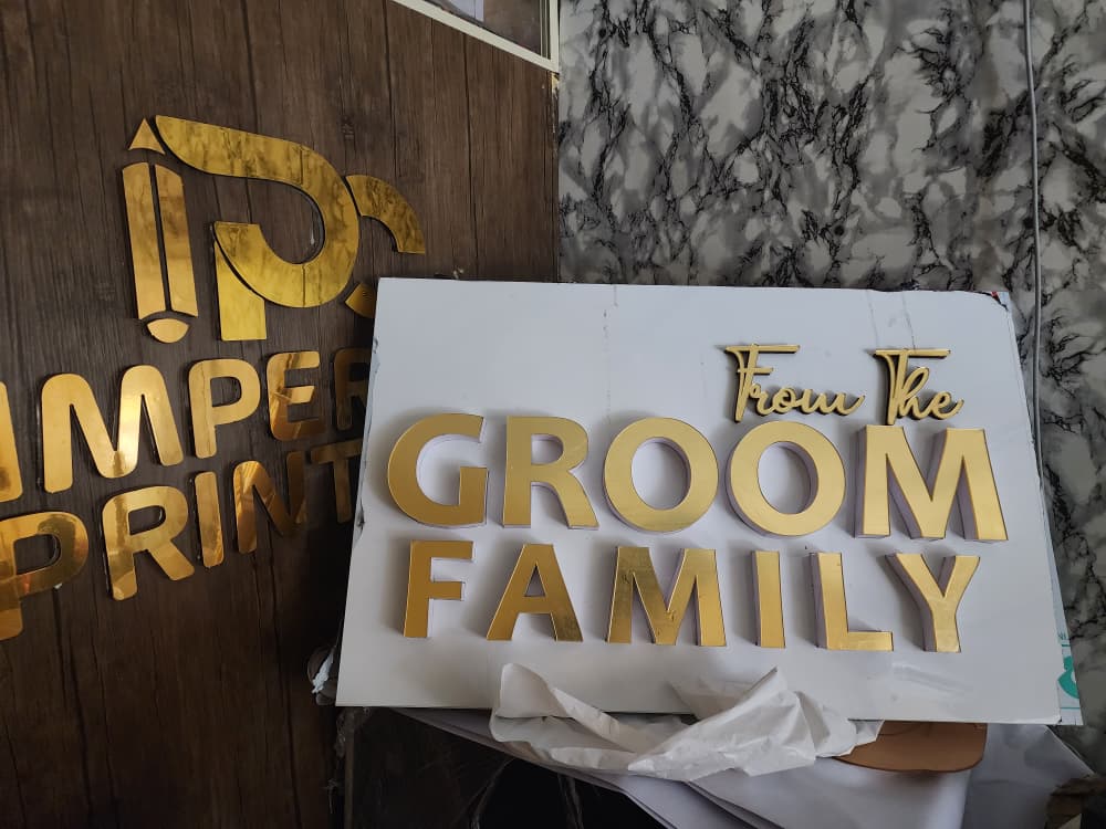 Fabricated gold 3D "From The Groom Family" wedding reception signage