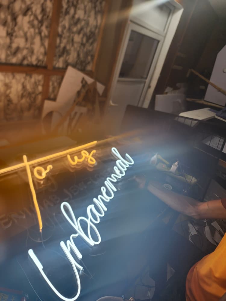 Custom "To My Urbanemeal" script neon sign in warm gold and white