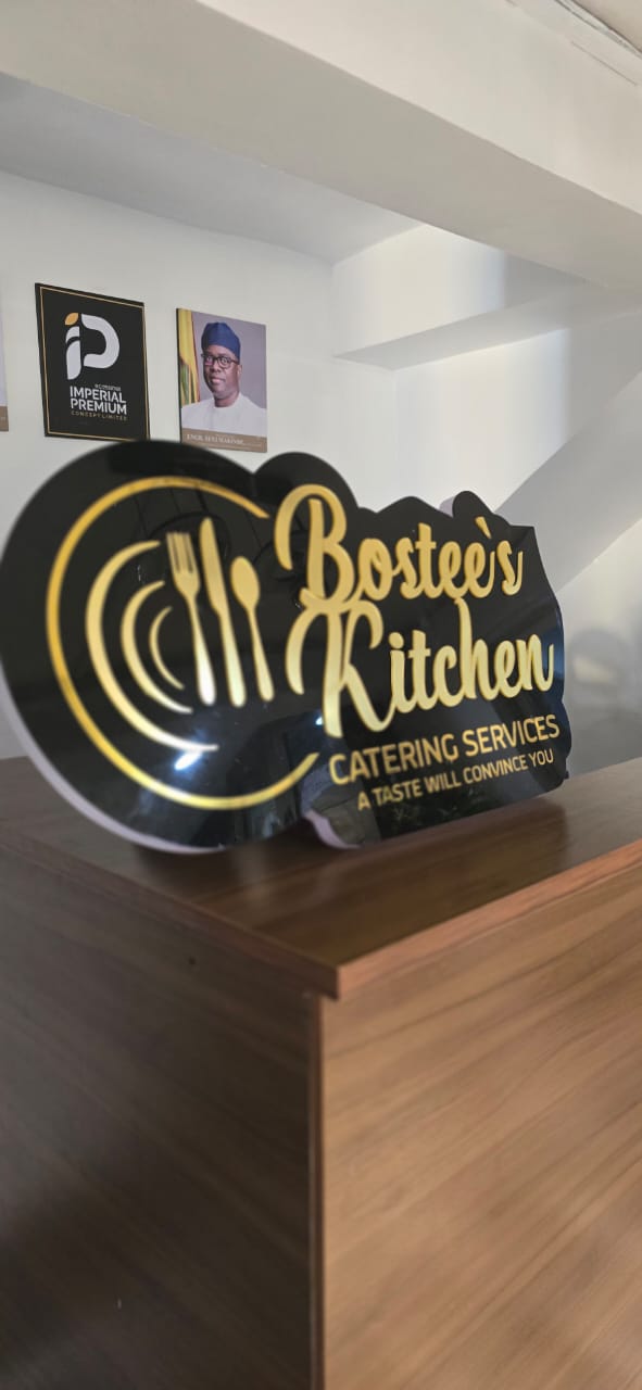 Event backdrop with LIQUOR.ng and THE PATIO logos in white and gold