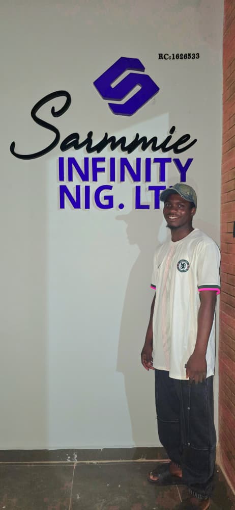 Black and purple 3D acrylic wall signage installed for Sarmmie Infinity Nig. Ltd