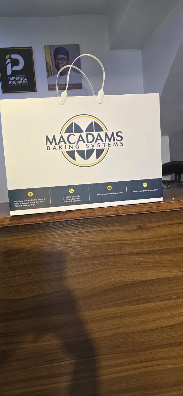 Custom corporate paper gift bag for Macadams Baking Systems with contact details