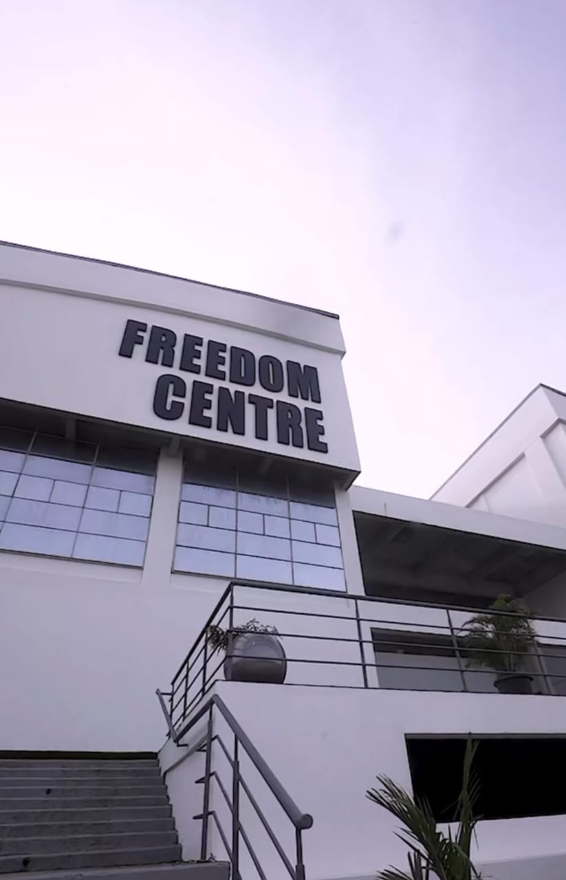 Bold 3D fabricated Freedom Centre lettering installed on the building facade