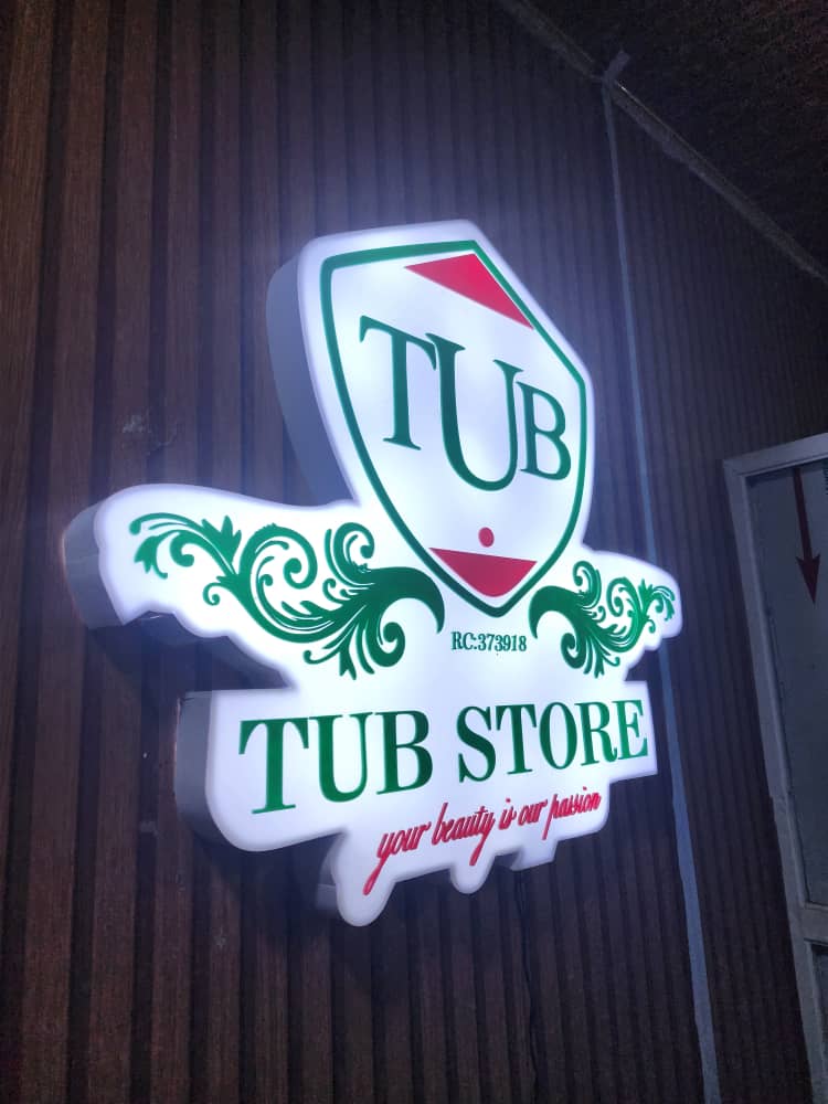 Illuminated die-cut TUB Store shield signboard — your beauty is our passion
