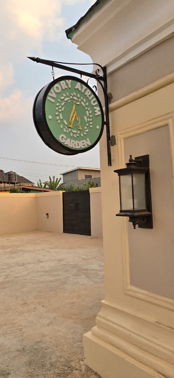 Hanging Ivory Atrium Garden signboard mounted on building exterior
