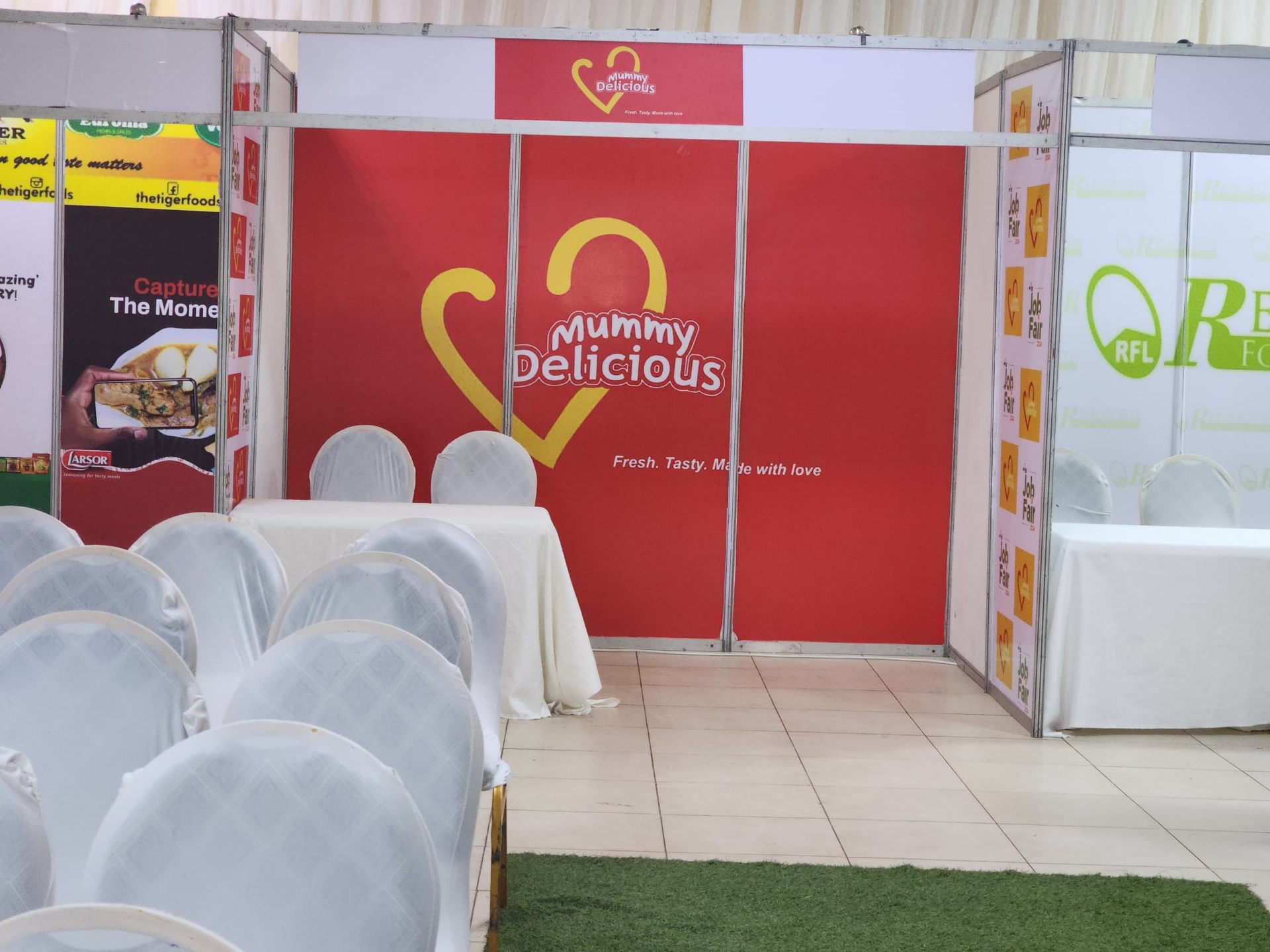 Branded exhibition booth backdrop for Mummy Delicious — Fresh. Tasty. Made with love