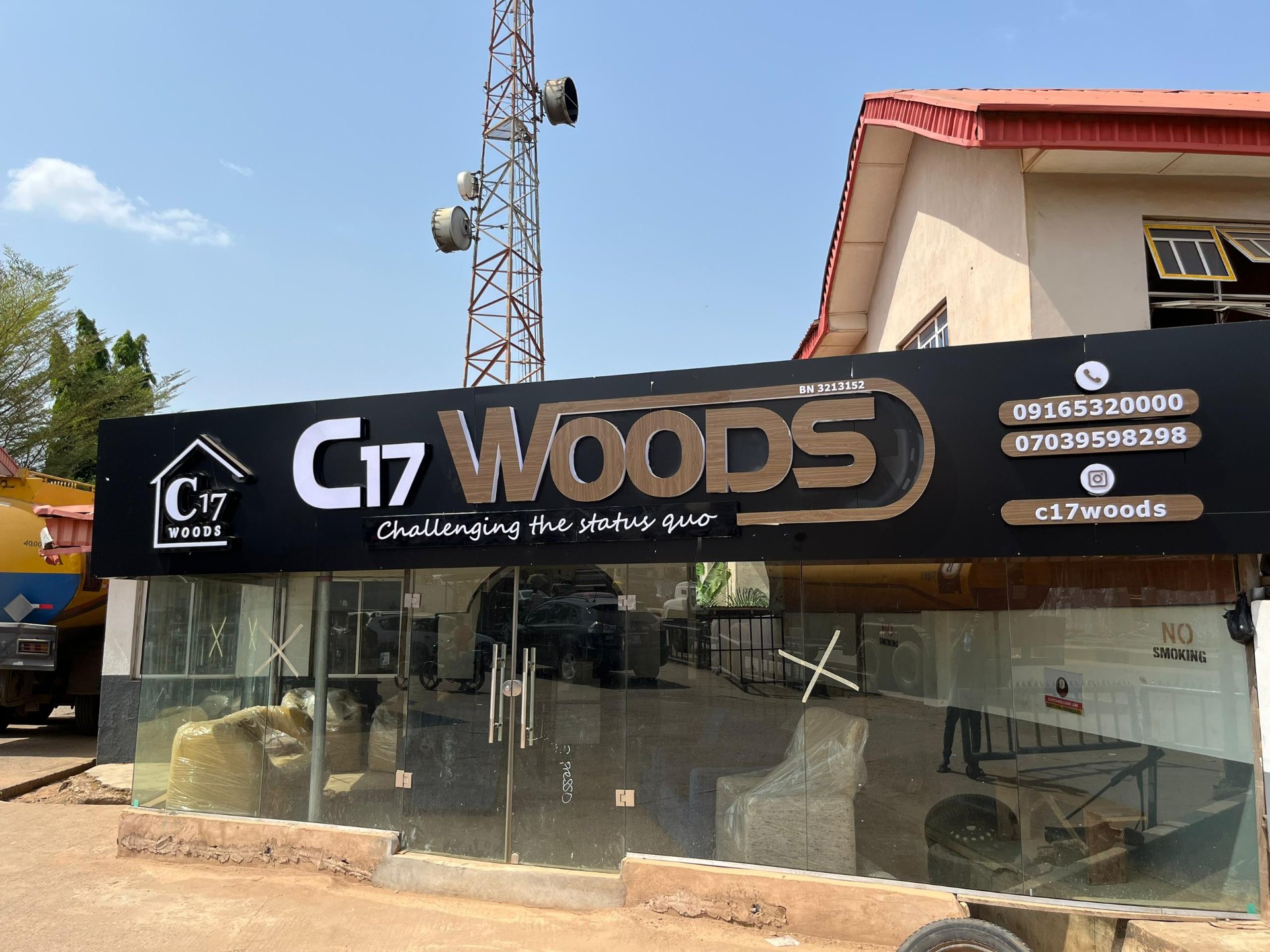 Illuminated C17 Woods storefront fascia signage with woodgrain channel letters